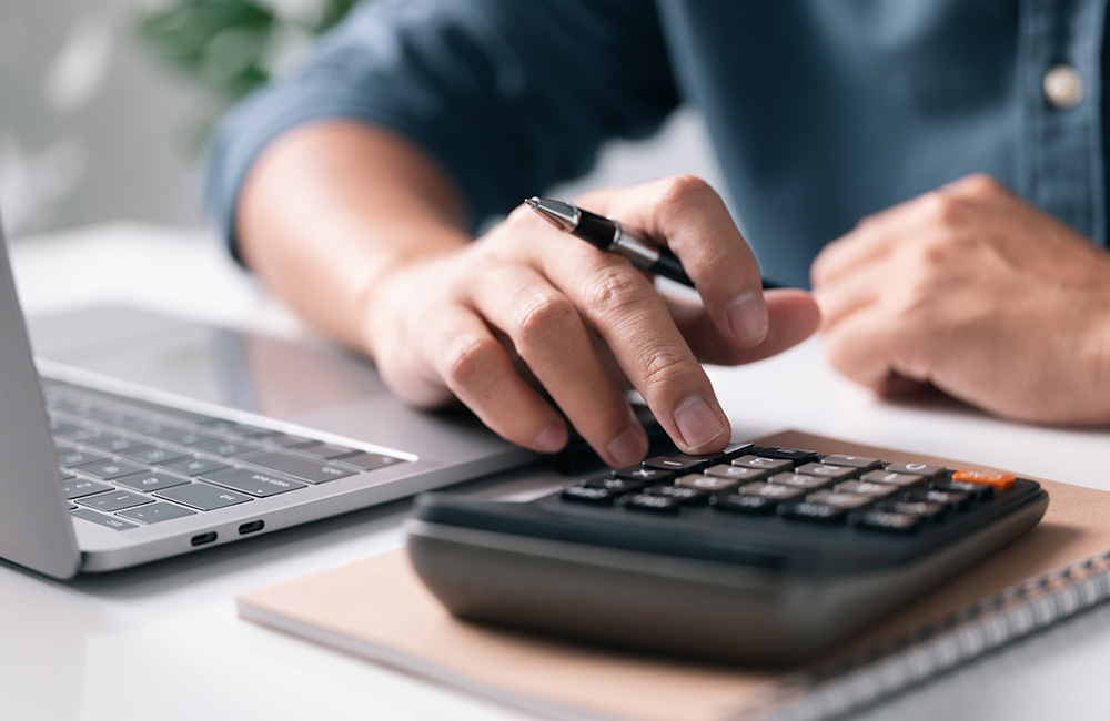 Man using calculator 